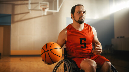 Portrait of Handsome Wheelchair Basketball Player Wearing Red Shirt Dribbling Ball, Ready to Shoot it Perfectly. Determined Person with Disability who is Gonna Win and be Champion