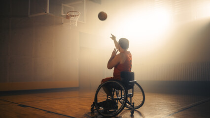 Wheelchair Basketball Player Wearing Red Uniform Shooting Ball Successfully, Scoring a Perfect...