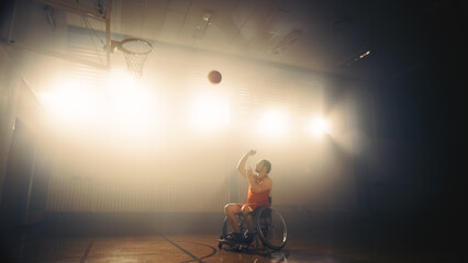 Portrait of Wheelchair Basketball Player Shooting Ball to Score a Perfect Goal. Determination, Training, Inspiration of Person with Disability. Cinematic Shot with Warm Colors.