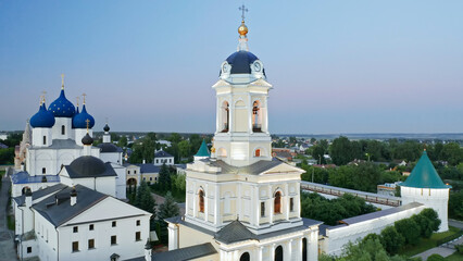 Fototapeta na wymiar Evening sky over the city, Vysotsky monastery in the evening, Christian churches of Serpukhov, Beautiful summer aerial shots, cities of Russia