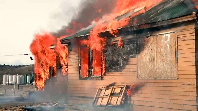 Structure fire burns two story home with a metal roof