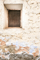 Old chipped house facade in Spain