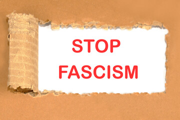 Phrase STOP FASCISM instead of a piece of torn cardboard. The concept of peace on planet Earth