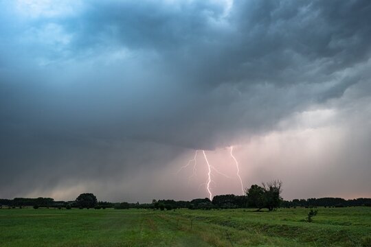 Dramatic image of a double lightning strike on the plains at dusk