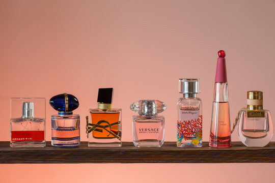 Krichev, Belarus, 25 February 2022:  A various bottles with eau de parfum fragrance on pink background