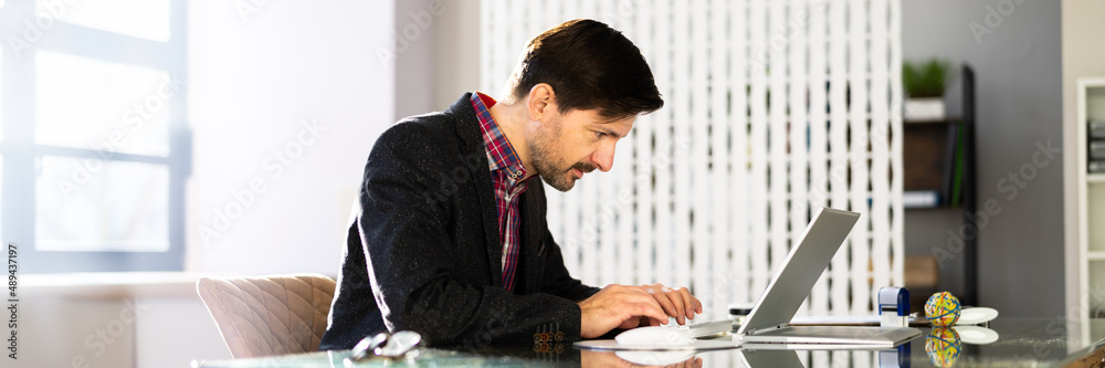 Poster Man Sitting In Bad Posture Working On Computer