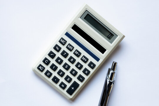 calculator and pen on a white background