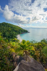 Obraz premium sunset at tropical beach anse georgette on praslin on the seychelles