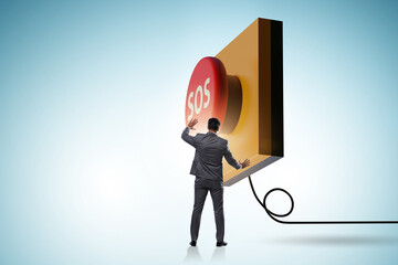 Businessman pressing SOS button in case of danger