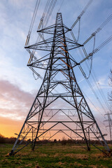 Fabulous sunset behind a close up picture of an electricity pylon