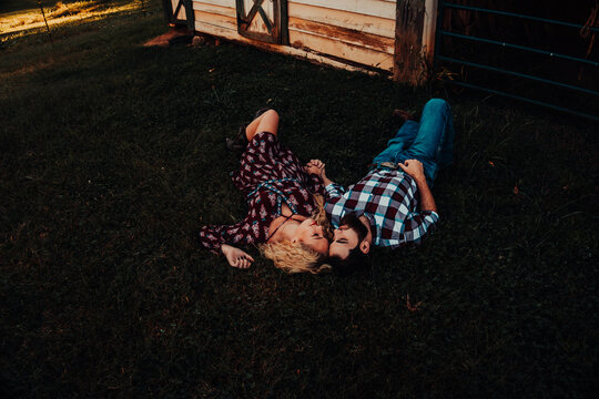 Couple Laying In The Grass