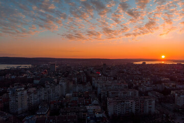 Obraz premium Cityscape from above. Sunset with dramatic clouds with drone