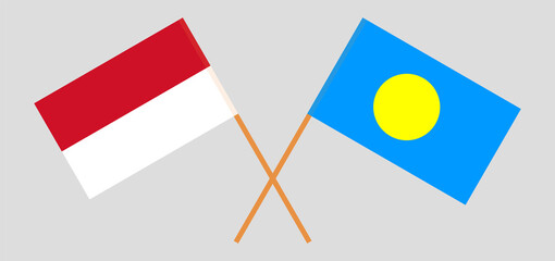 Crossed flags of Indonesia and Palau. Official colors. Correct proportion