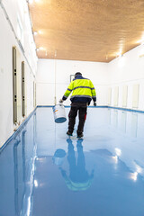 Self leveling blue epoxy floor in the gym