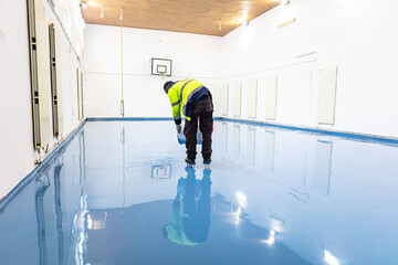 Self leveling blue epoxy floor in the gym