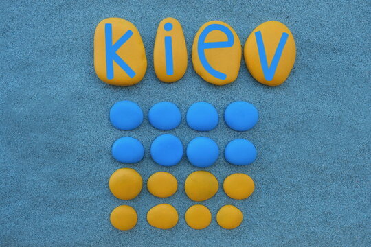Kiev, capital of Ukraine, souvenir composed with blue and yellow colored stones over green sand