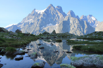 Fototapeta na wymiar Amazing reflections in lake Tuckett looking Mont Pelvoux in the French alps 