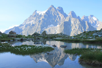 Fototapeta na wymiar Amazing reflections in lake Tuckett looking Mont Pelvoux in the French alps 