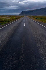 Beautiful aerial view of the great lonely highways crossing between mountains and nature, in Iceland 