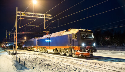 Heavy iron ore train at Abisko in Swedish Lapland in winter
