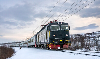 Passenger train at Abisko in Swedish Lapland in winter