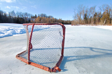 Tranquillity scene of hockey rink in the frozen lake