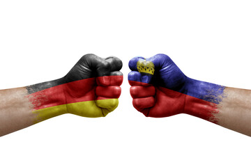 Two hands punch to each others on white background. Country flags painted fists, conflict crisis concept between germany and liechtenstein