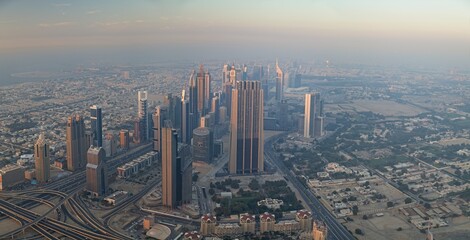 Panorama of buildings and fountains in the city of Dubai from the Burj Khalifa, the tallest building in the world in the United Arab Emirates.