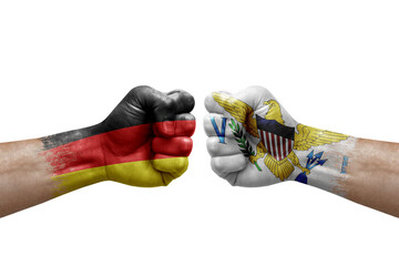 Two hands punch to each others on white background. Country flags painted fists, conflict crisis concept between germany and virgin islands