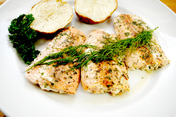 Plated Salmon Dinner with Pepper, Parsley, Garlic and Fresh Dill