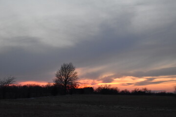 Dramatic Sunset Over a Rural Field