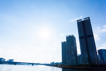 Tower apartments lined up along the river and a refreshing blue sky_37