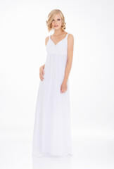 Fototapeta na wymiar Pure elegance. Studio shot an attractive young woman in white dress.