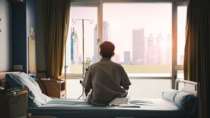 patient sat on the bed and looked out the window in the hospital alone and had stress, boredom, loneliness, anxiety. / Health care and medical