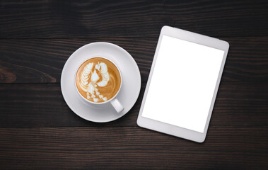 Empty tablet and a coffee on  desk