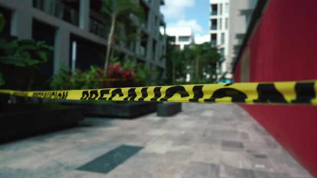 Caution Police line do not cross tape protect crime scene movement with wind. High quality 4k footage