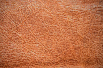 Genuine leather texture background. Dark brown, orange textures for decoration blank. Vintage skin natural suede.