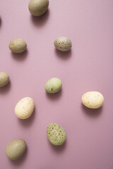 Easter Eggs on Purple Pastel Background