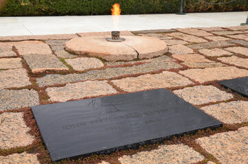The eternal flame continuously burns at the grave of John F Kennedy in Arlington National Cemetery...