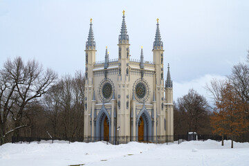 The old church of Alexander Nevsky in the Gothic style on a cloudy February day. Alexandria Park....