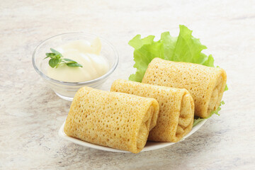 Stuffed pancakes with meat and cream