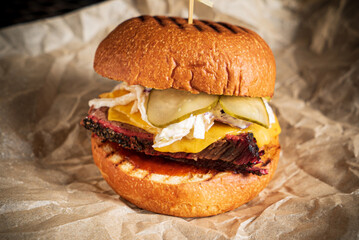 creative burger with beef and pickles