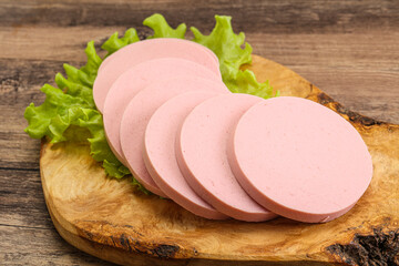 Sliced sausage snak over board