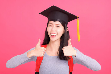 Excited asian  girl college student in Graduation cap  with success gesture