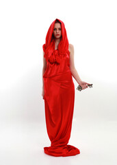 Full length portrait of red haired woman wearing a  beautiful sexy silk gown costume, standing pose...