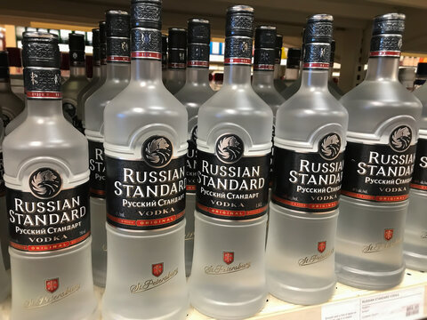 Bottles of Russian Standard, a major premium brand vodka spirit made in Russia, on a liquor store shelf. 