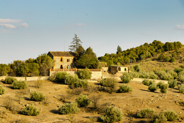 Fototapeta na wymiar beautiful old house located on a mountain in the city of toledo in spain, surrounded by a vast native vegetation