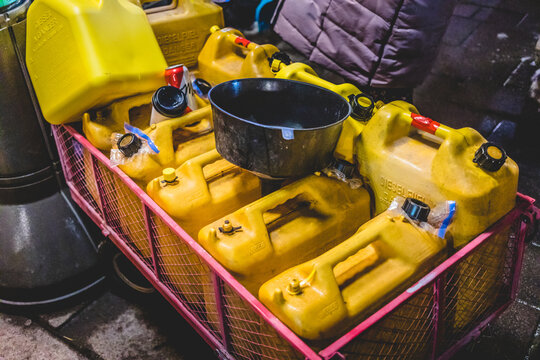 Ottawa, Ontario, Canada - February 10, 2022. Diesel Fuel Jerry Cans in a Transporting Rack at Night During Freedom Convoy in Ottawa.