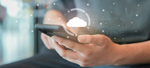 man hand hold smartphone to use transfer or synch data upload and download from cloud computing with virtual interface in operation room, technology business concept
