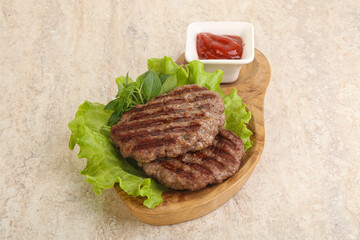 Grilled beef burger cutlet with sauce